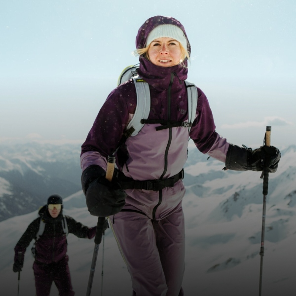 Woman skiing in snow-covered mountains.